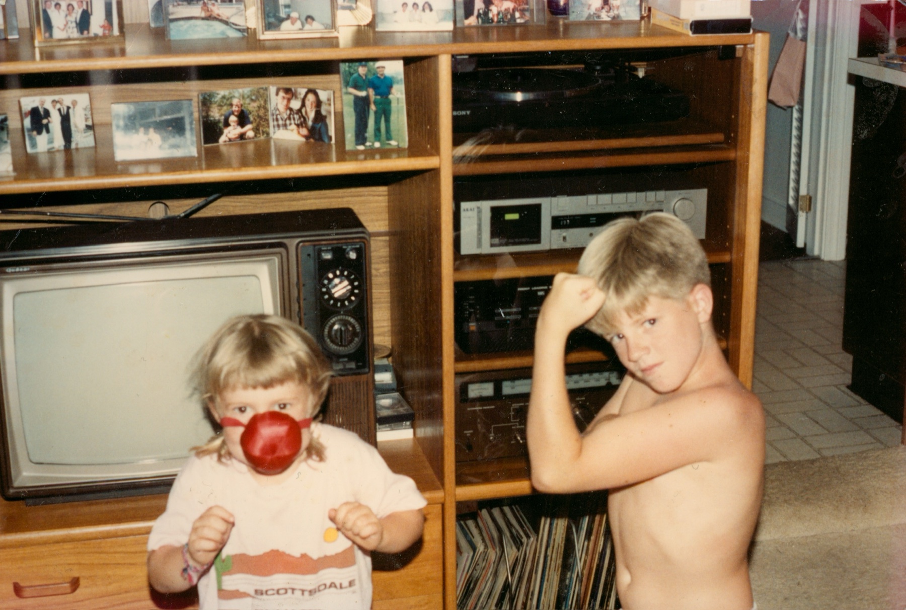 Brian as a child posing playfully at home