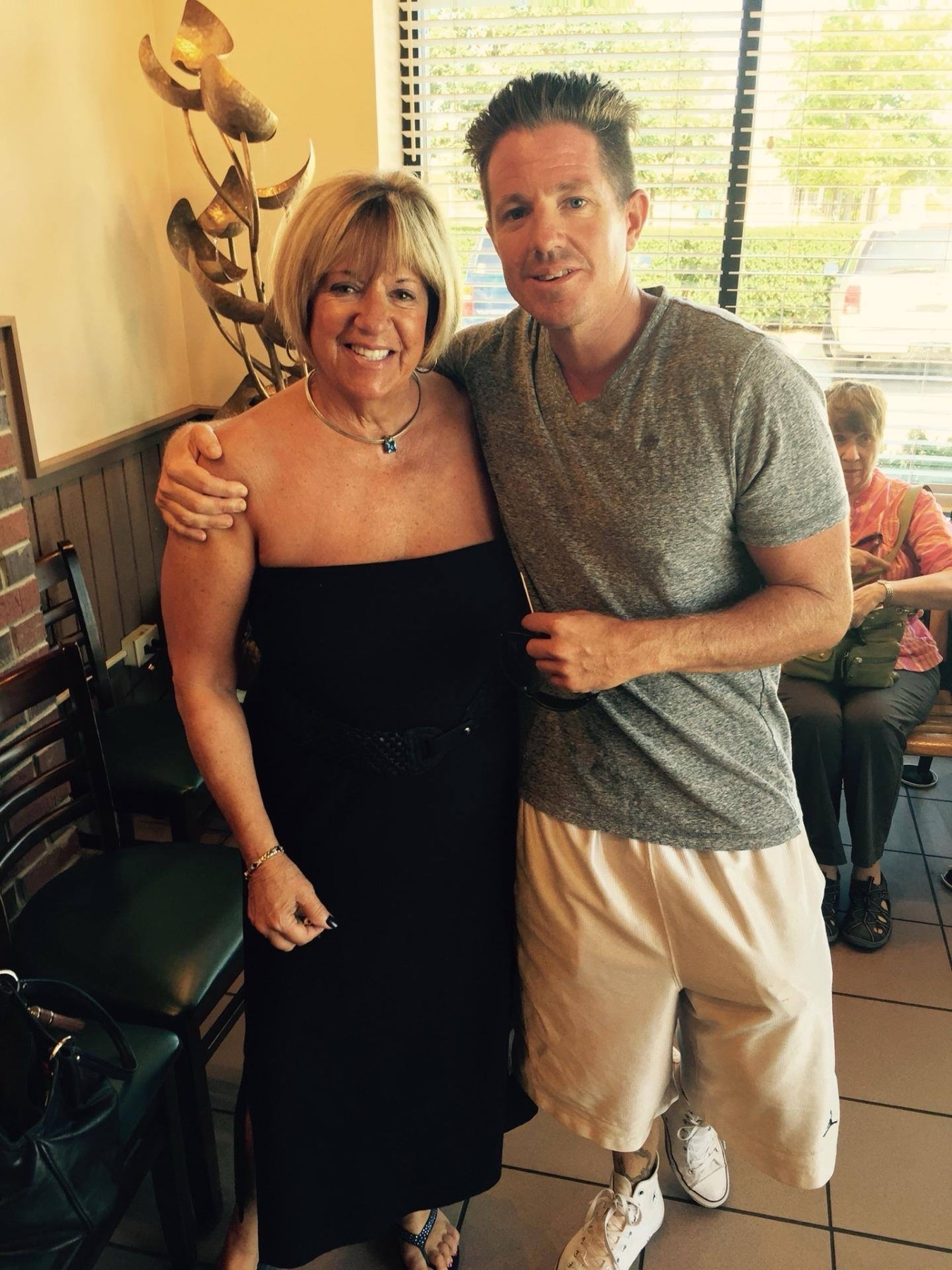 Brian smiling with family