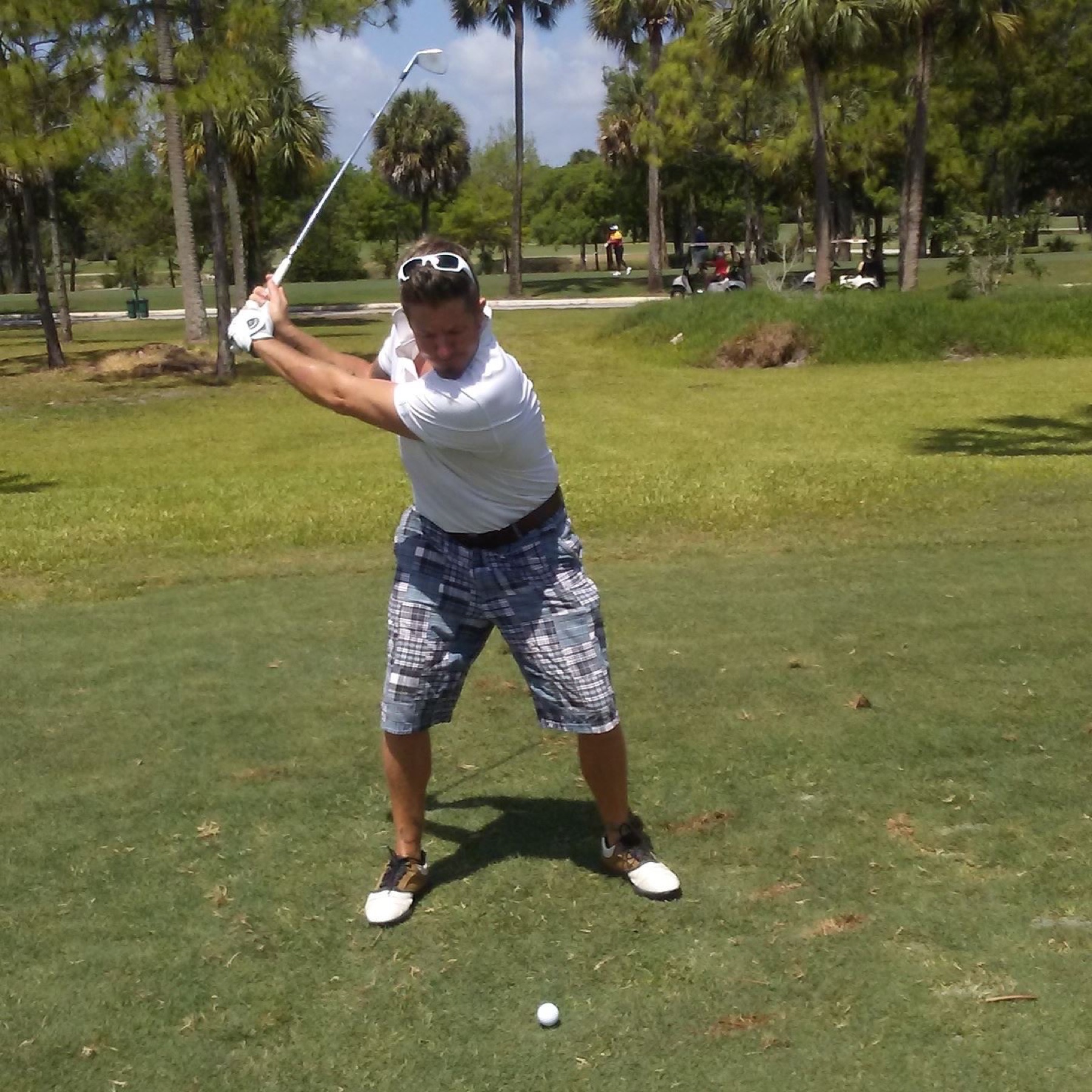 Brian preparing to swing a golf club