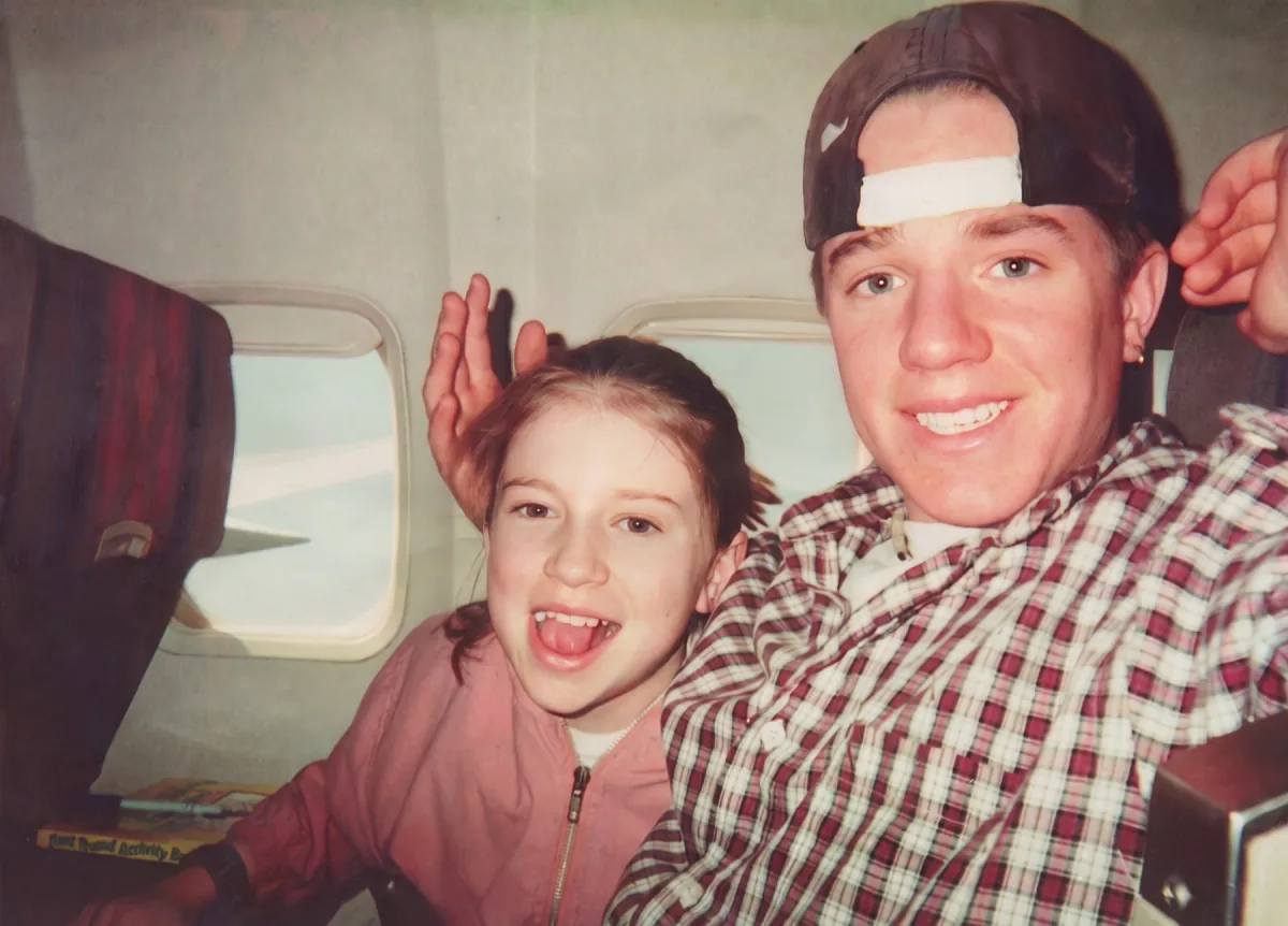 Brian Vulbrock taking a plane selfie with family